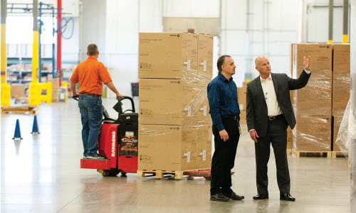 Arbor Consultant and Employee Discussing Racking and Shelving